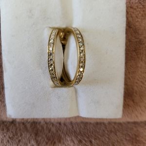 14kt gold hoop diamond earrings.